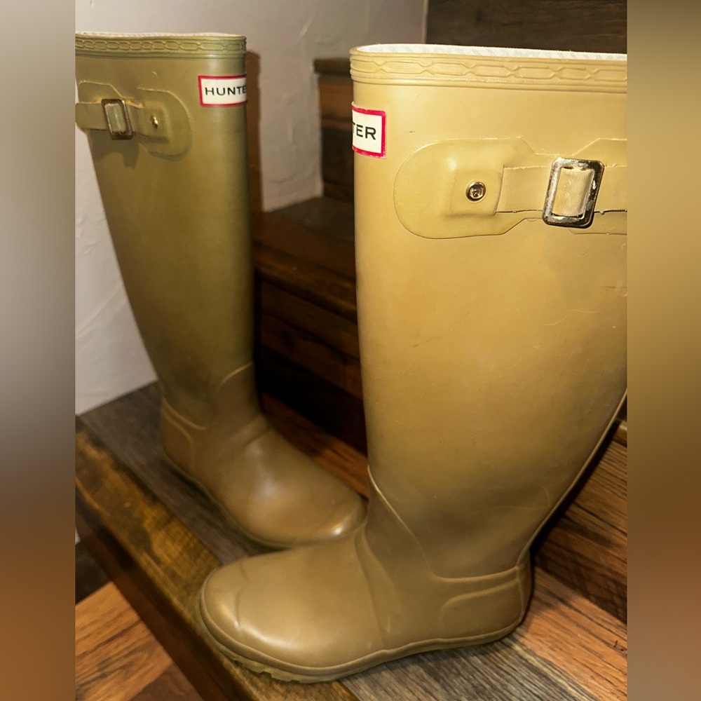 “Hunter” tall rubber boots with traction gripping sole.